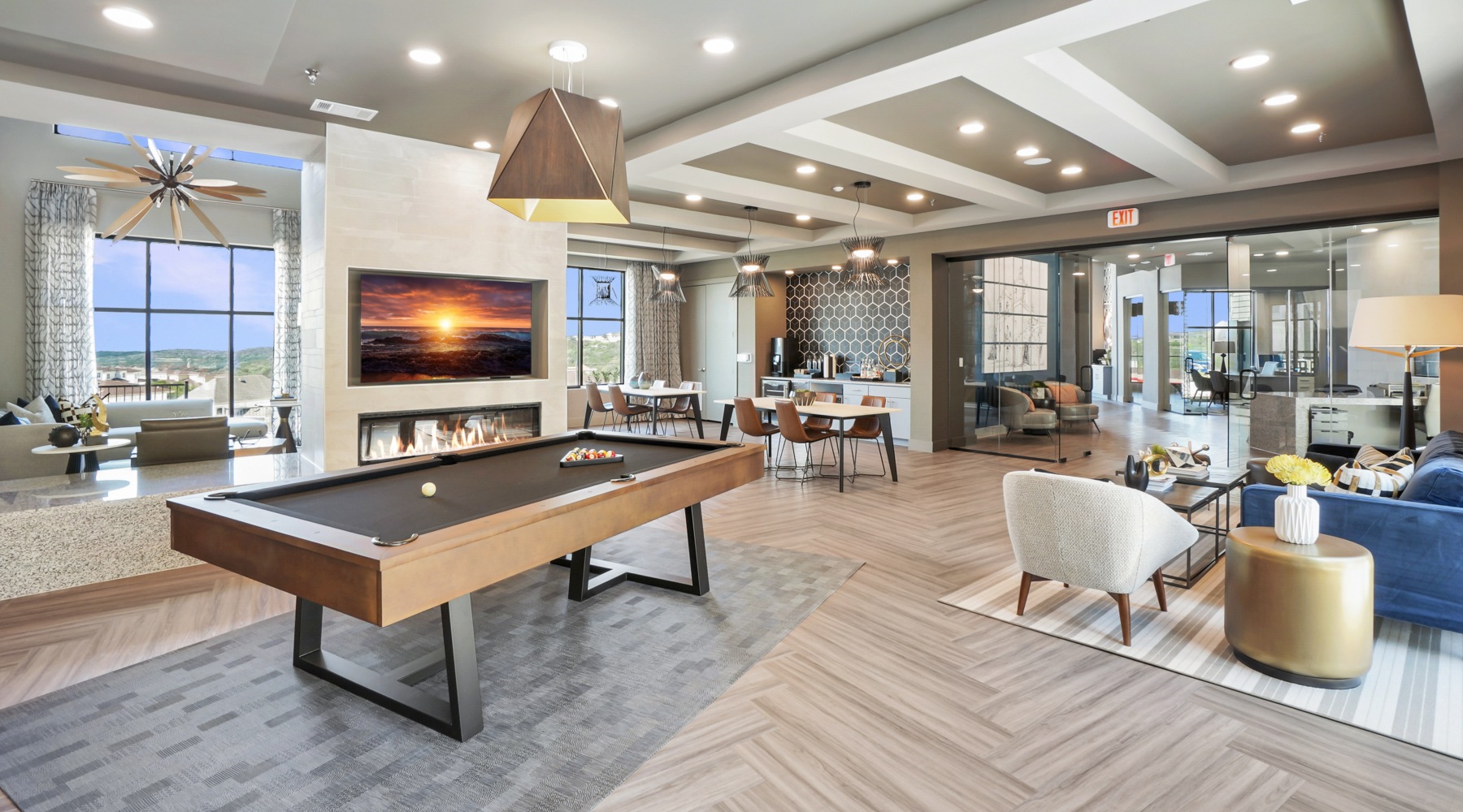 Expansive clubroom with pool, TVS, beverage bar, and more